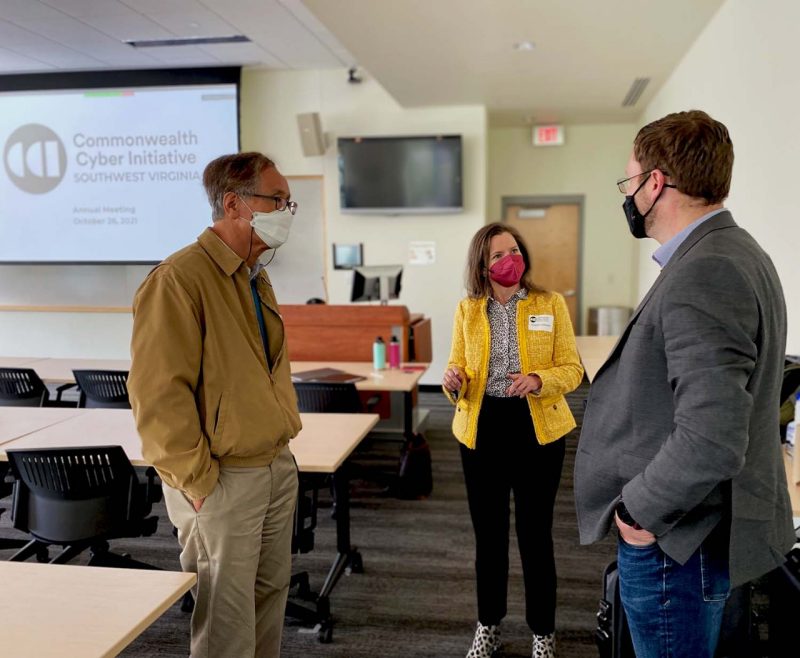 Researchers Dong Ha (right), Gretchen Matthews (center), speak with Joe Simpson, director of the ISERC.
