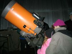 Guests looking through the telescope during and open house.