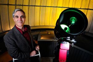 Prof. John Simonetti with the 14-inch Schmidt-Cassegrain telescope at the Martin Observatory.